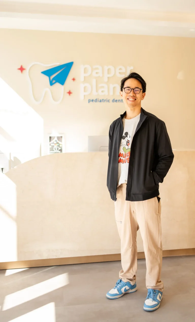 Dr. Christopher Pae, board-certified pediatric dentist, in the Paper Planes office